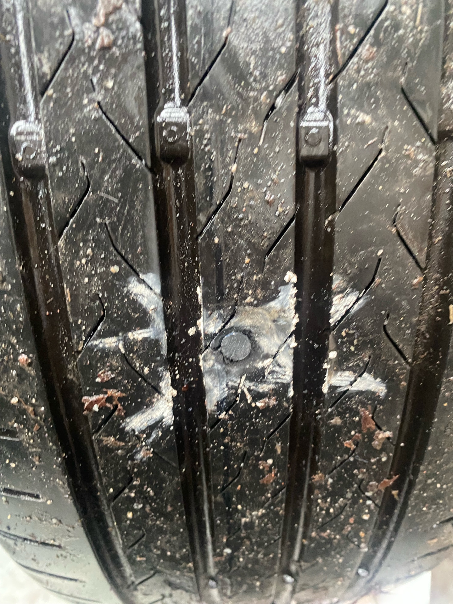 Nail in tyre tread — typical repairable puncture